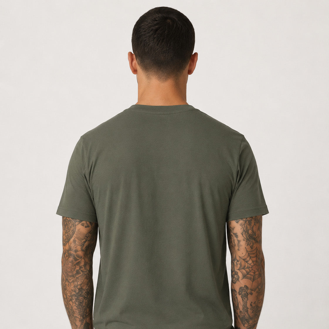 Rear studio photograph of a male model wearing the Sauce & Brown Outland khaki T-Shirt.