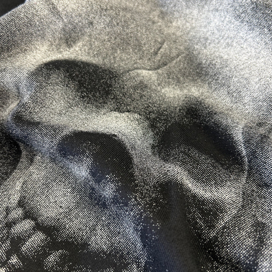 Close-up of the grayscale skull graphic on the Sauce & Brown Relic black T-shirt, showing the print and fabric texture.