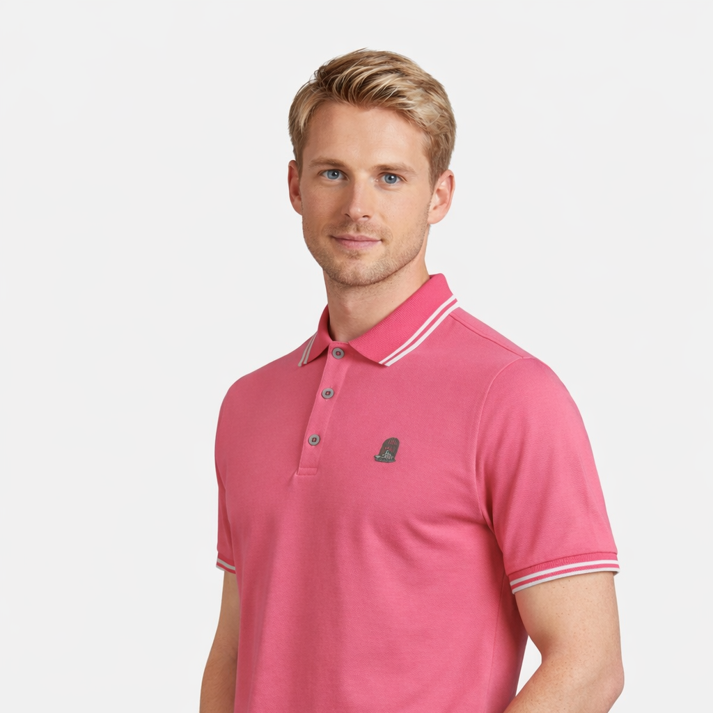 Angled view of Axel Polo in pink worn by model by Sauce & Brown