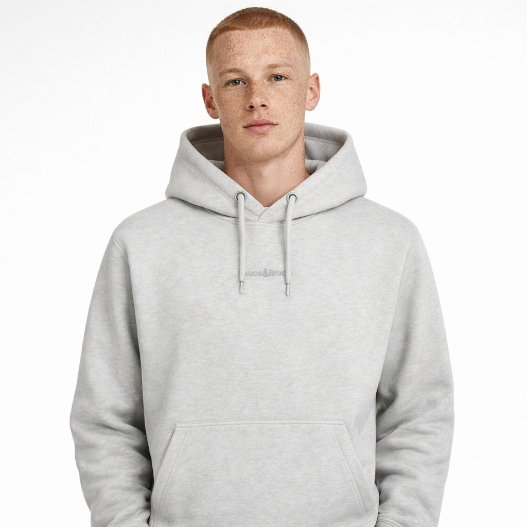 Daub Hoody in light grey with embroidered logo worn by model by Sauce & Brown