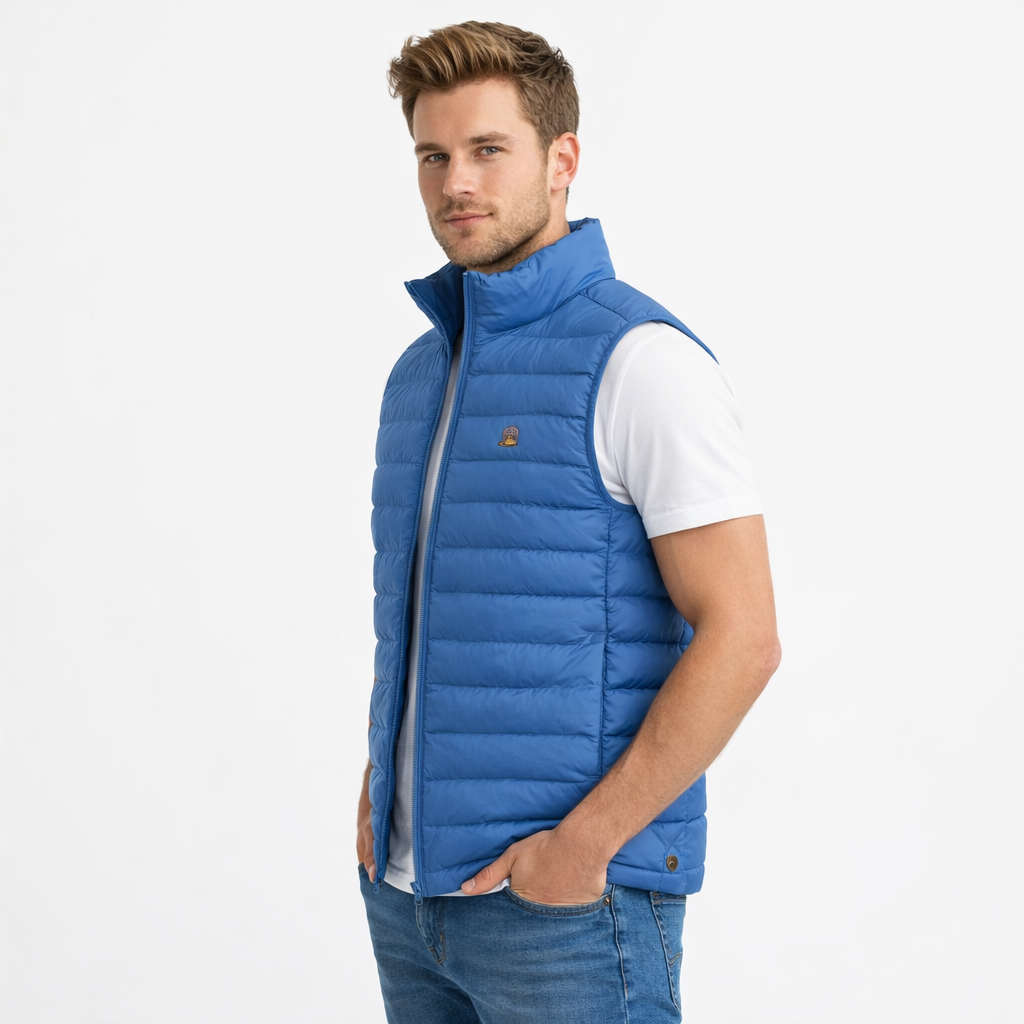 Angled view of Luna Gilet in blue worn by model by Sauce & Brown