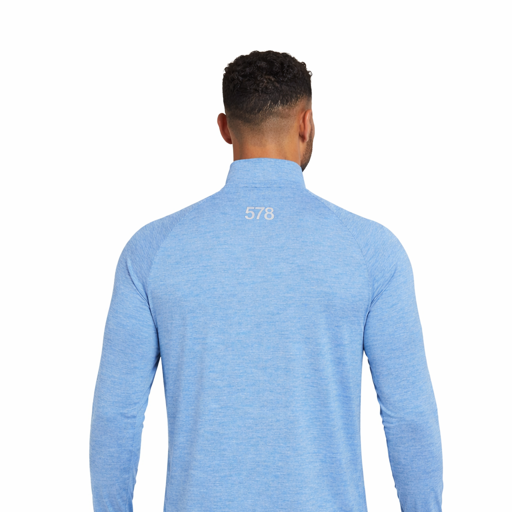 Rear view of Nova Sports Top in sky blue worn by model by Sauce & Brown