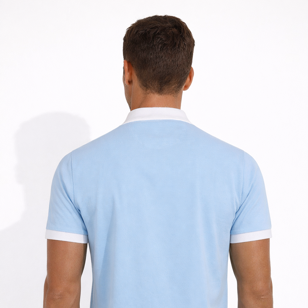 Rear view of Sola Polo in sky blue worn by model by Sauce & Brown