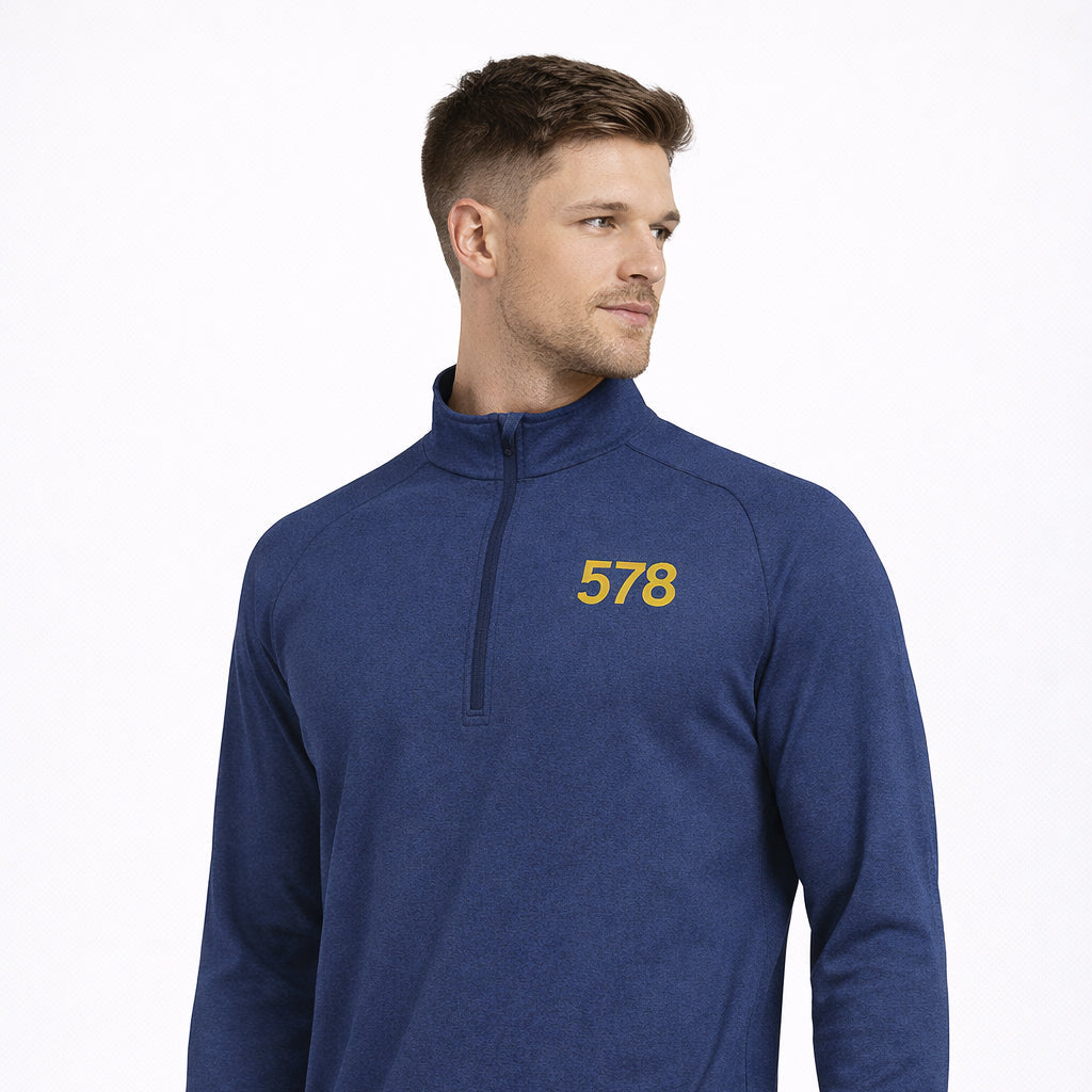 Angled view of Sports Base Top in blue with chest print worn by model by Sauce & Brown