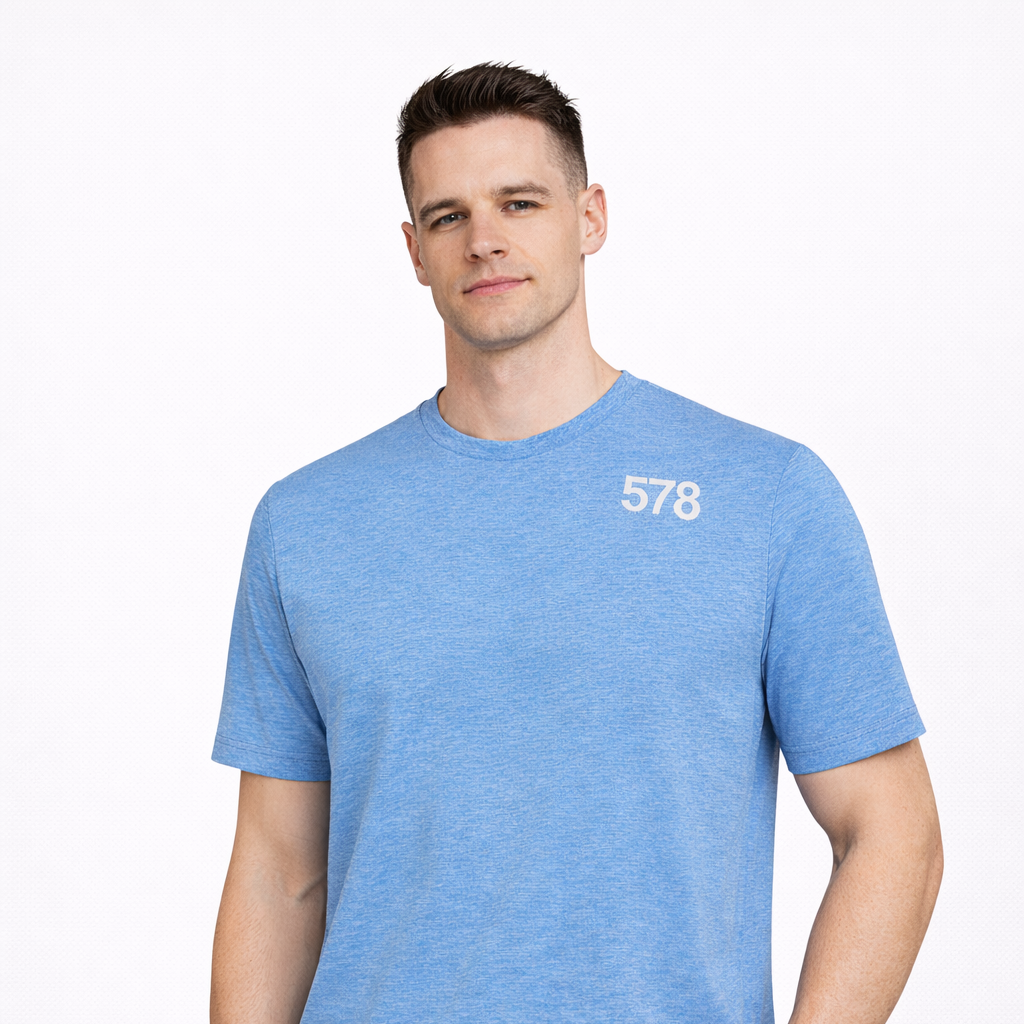 Sports Top in blue with white chest print worn by model by Sauce & Brown