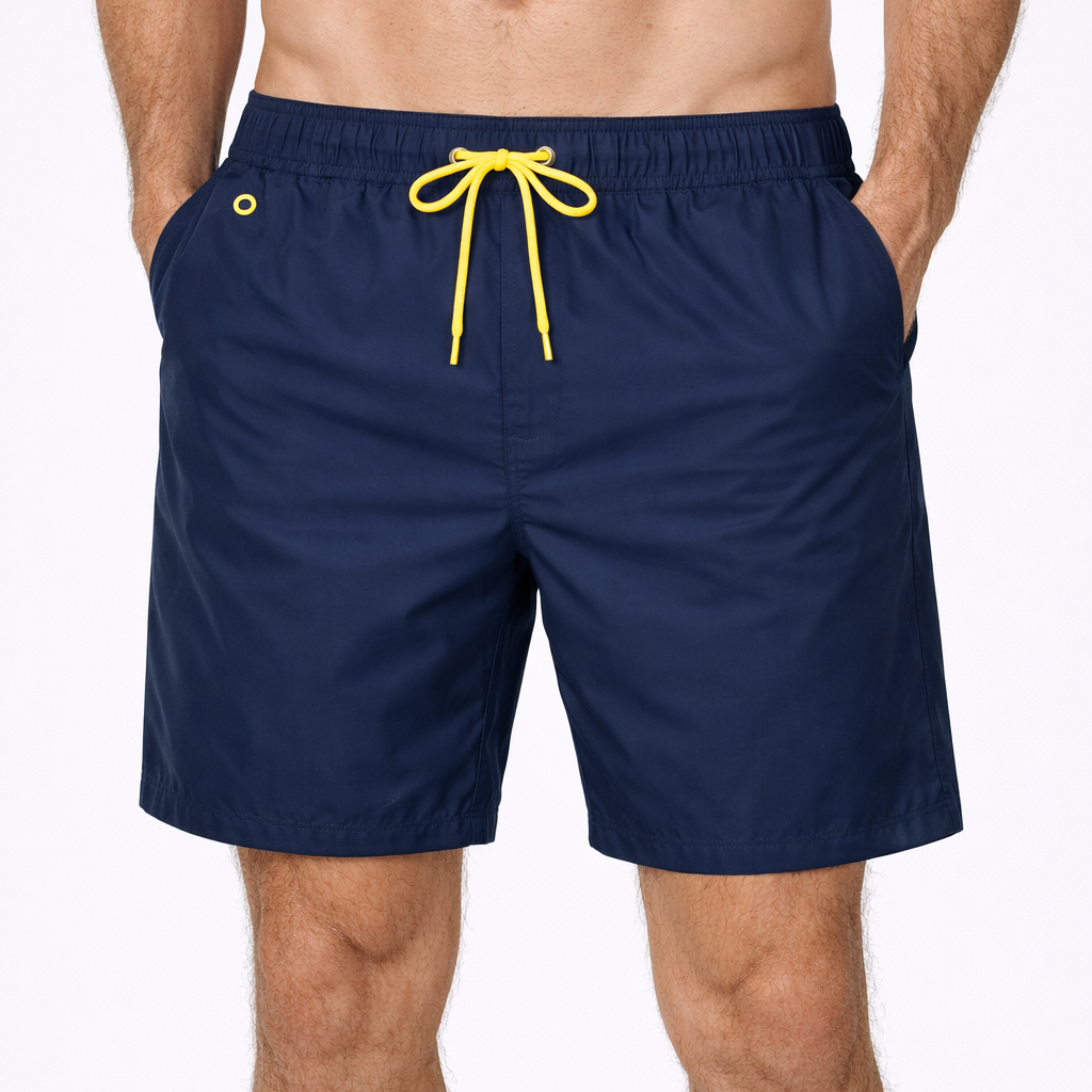 Tempest Swim Shorts in navy with yellow drawcord worn by model by Sauce & Brown