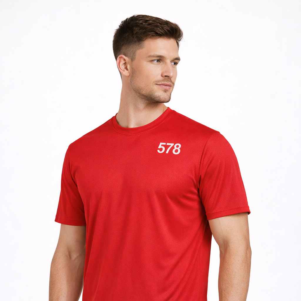 Angled view of Trent Sports Top in red worn by model by Sauce & Brown