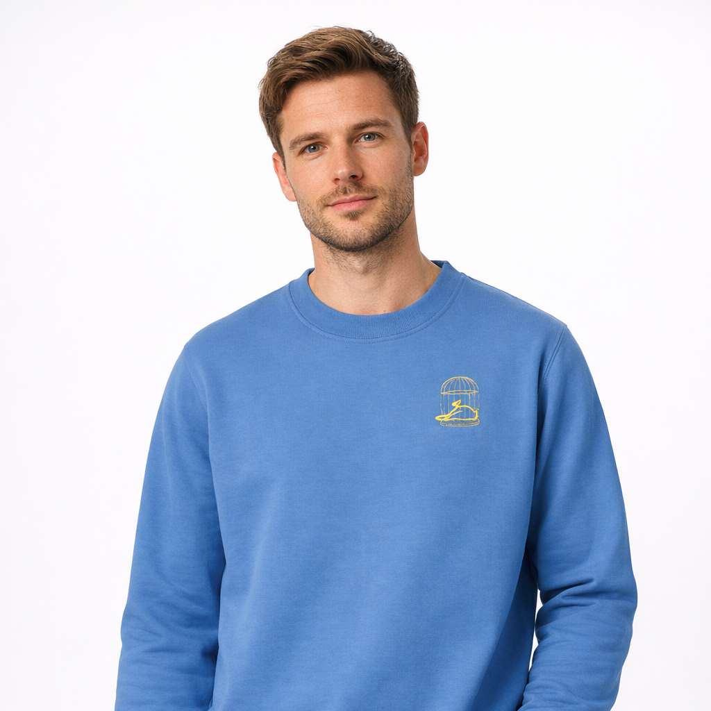 Sauce & Brown blue crewneck sweatshirt with Flo birdcage logo worn by male model