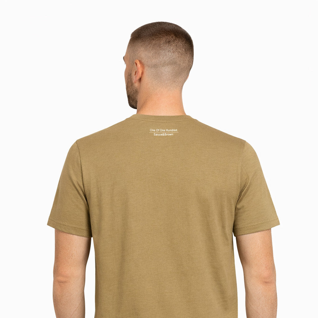 Back view of male model wearing Sauce & Brown Roots faded olive t-shirt with One Of One Hundred neck print