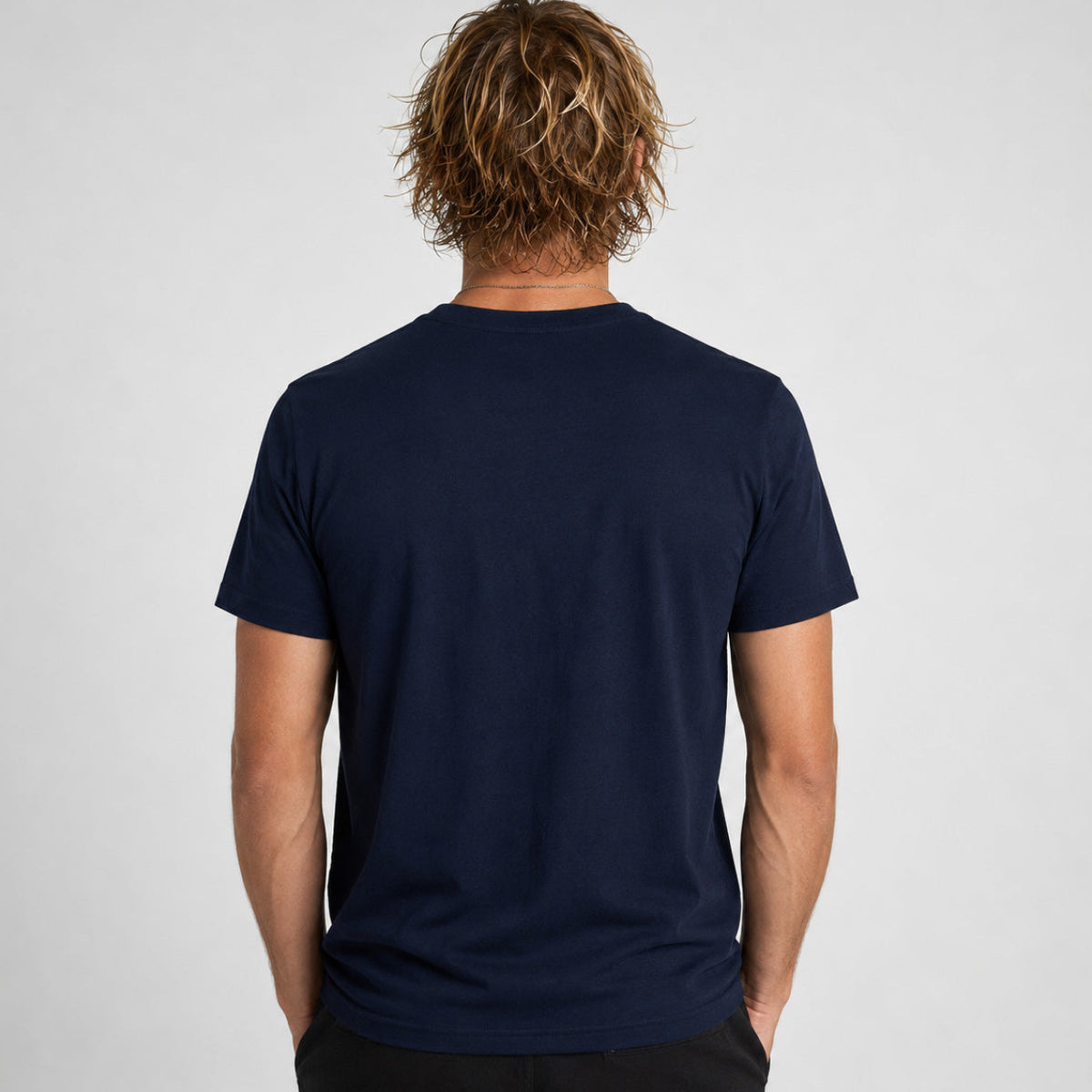Rear studio photograph of a male model wearing the Sauce & Brown Atlantic navy t-shirt.