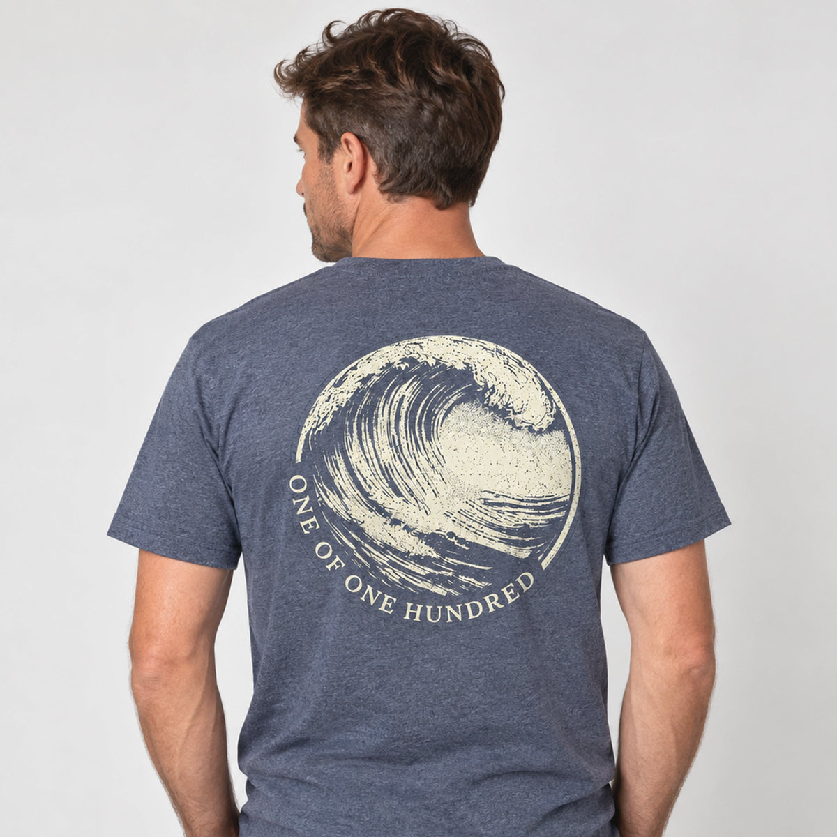 Evelyn Heather Navy T-Shirt by Sauce & Brown, showing the large One of One Hundred wave graphic on the back.
