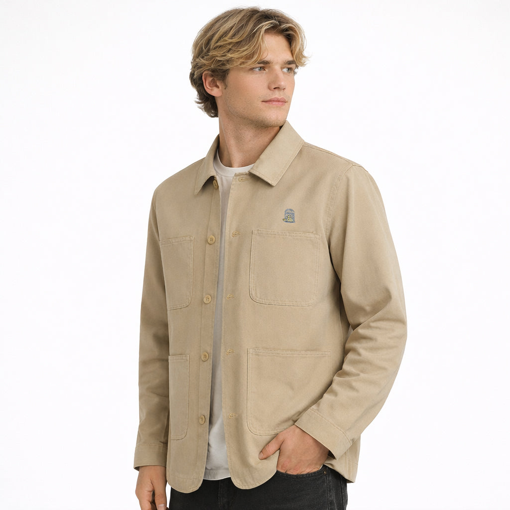 Bourne Jacket in sand with embroidered chest logo worn by model by Sauce & Brown
