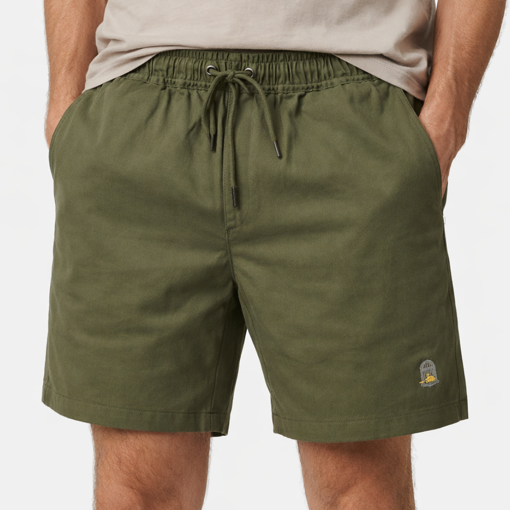 Field Shorts in olive green with embroidered logo worn by model by Sauce & Brown