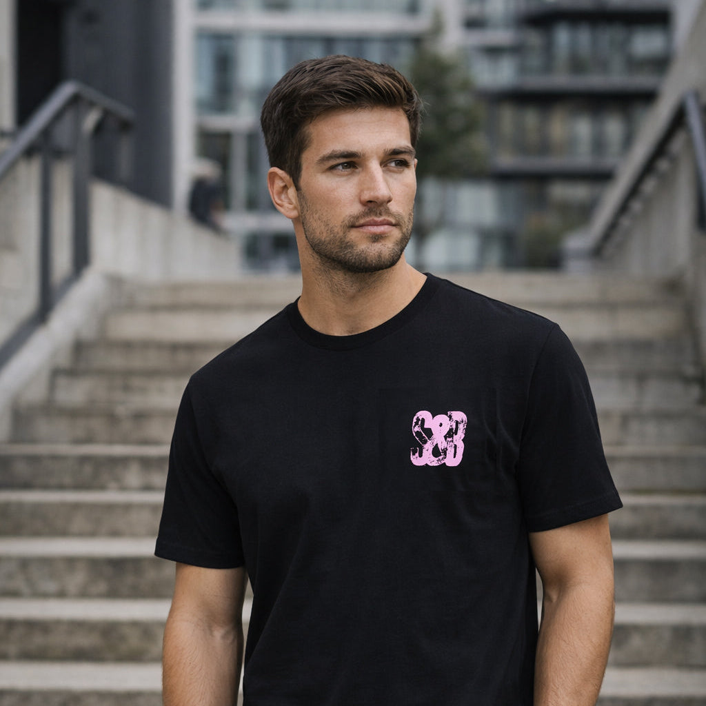 Model wearing Lilac Press Tee in black outdoors by Sauce & Brown