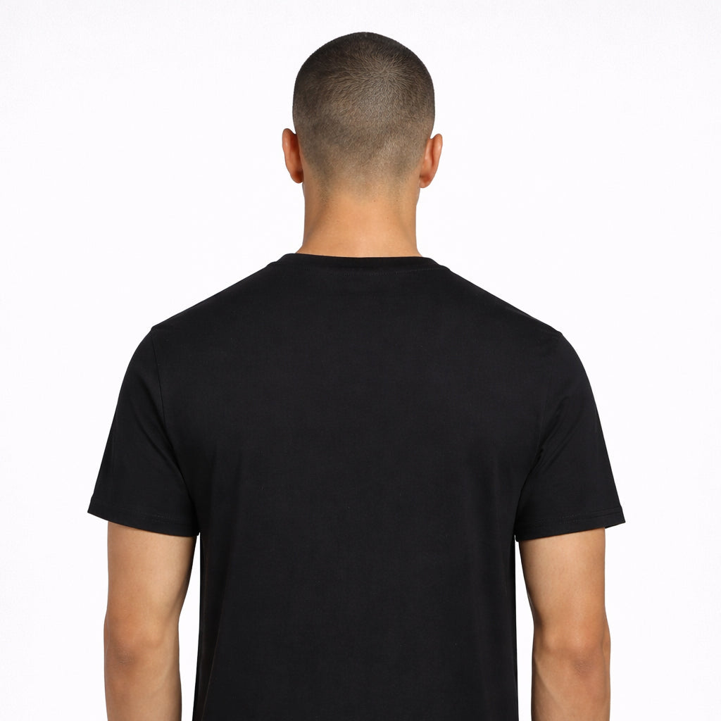 Rear view of Lilac Press Tee in black worn by model by Sauce & Brown