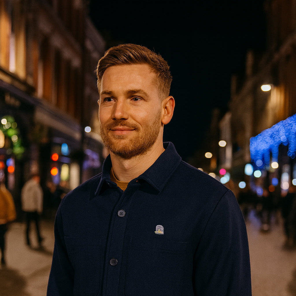 Model wearing North Jacket in navy at night by Sauce & Brown