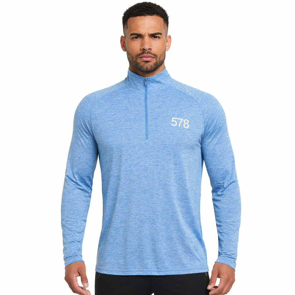 Nova Sports Top in sky blue with white chest print worn by model by Sauce & Brown
