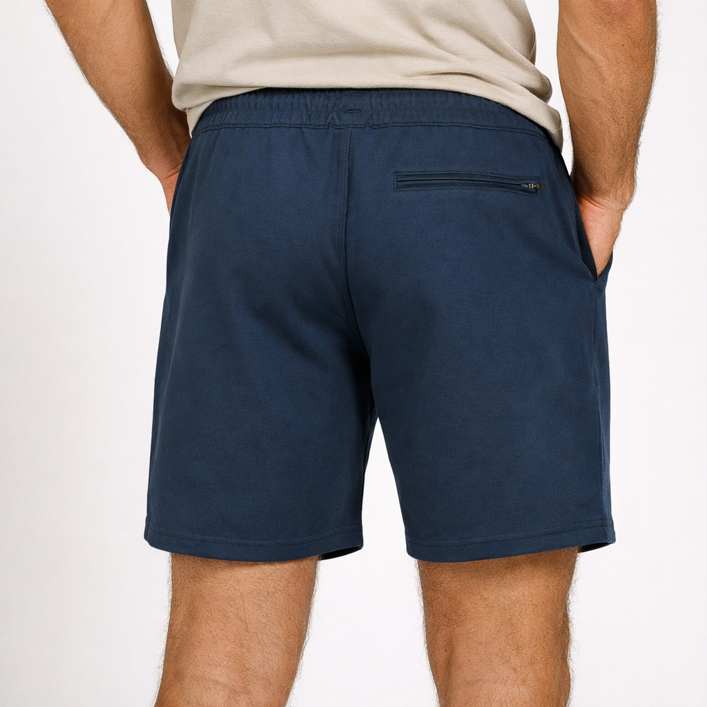 Rear view of Sauce & Brown navy shorts worn by model