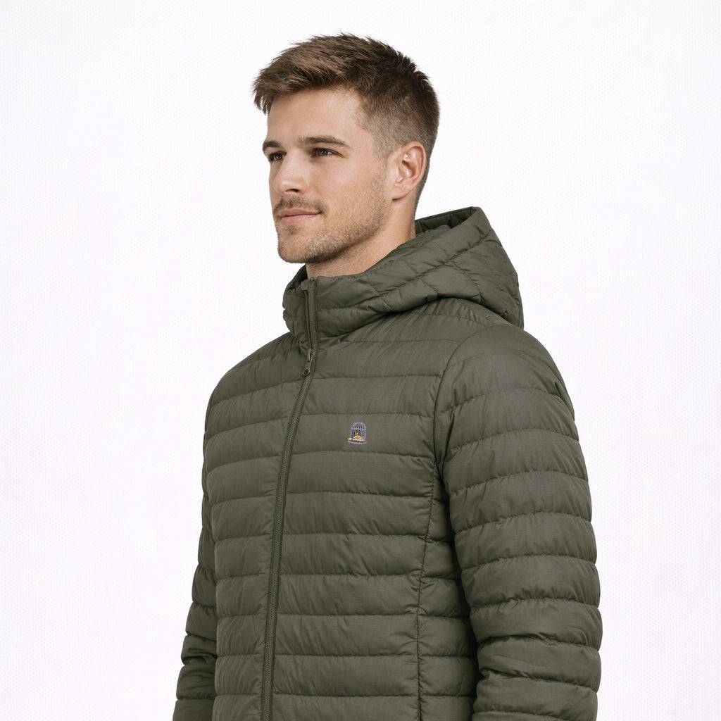 Angled view of Siege Jacket in olive green worn by model by Sauce & Brown
