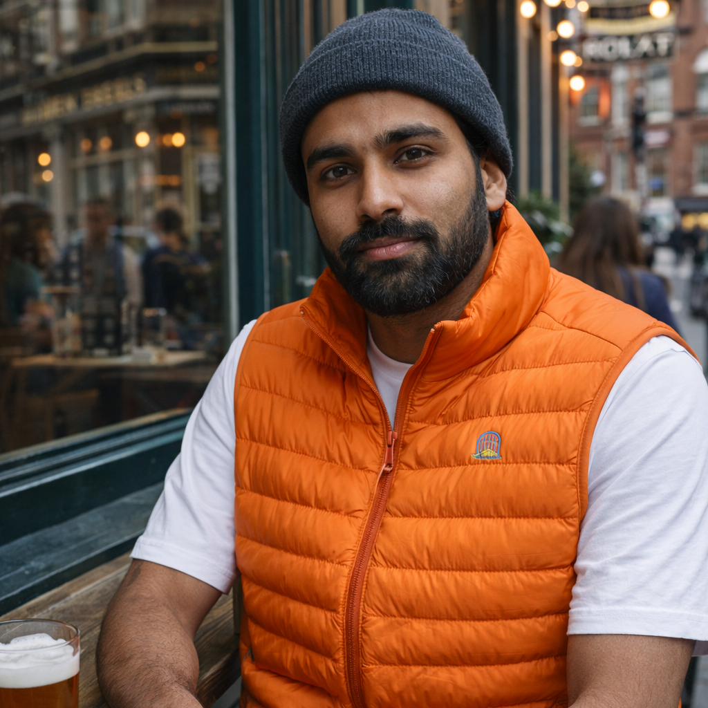 Model wearing Sol Gilet in orange outdoors by Sauce & Brown