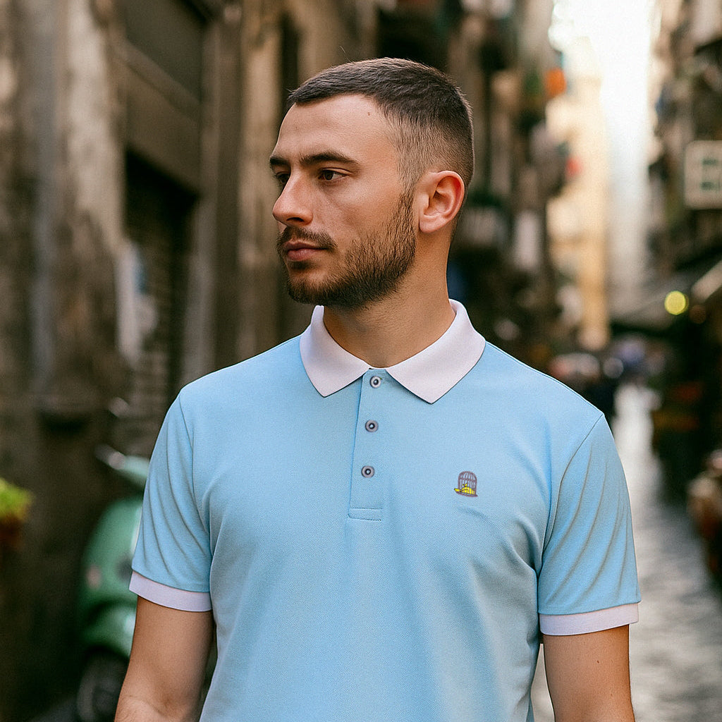 Model wearing Sola Polo in sky blue outdoors by Sauce & Brown