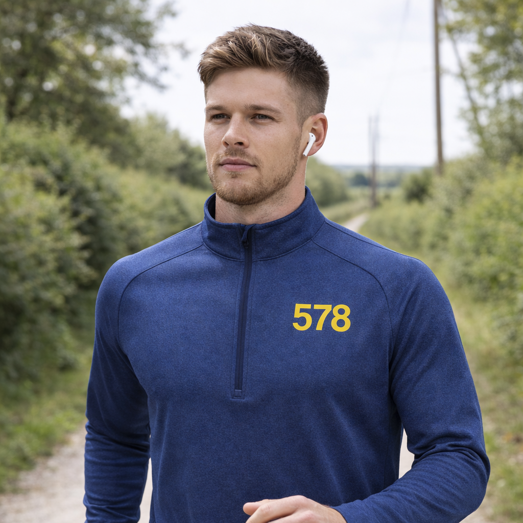 Model wearing Sports Base Top in blue outdoors by Sauce & Brown