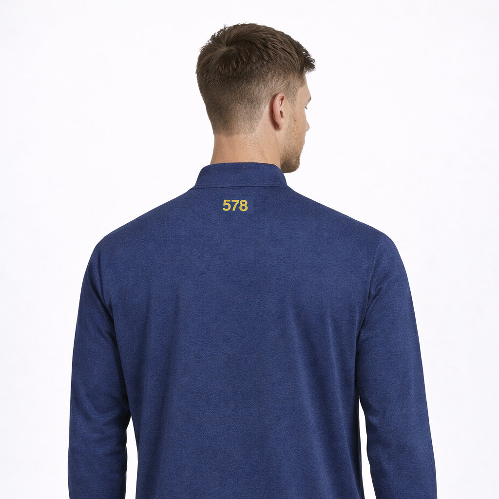 Rear view of Sports Base Top in blue worn by model by Sauce & Brown