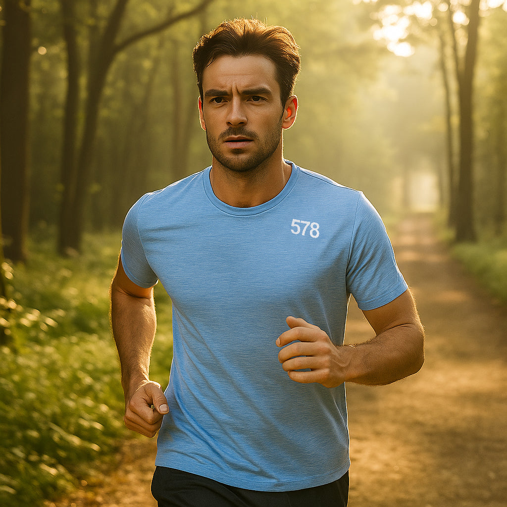 Model wearing Sports Top in blue running outdoors by Sauce & Brown
