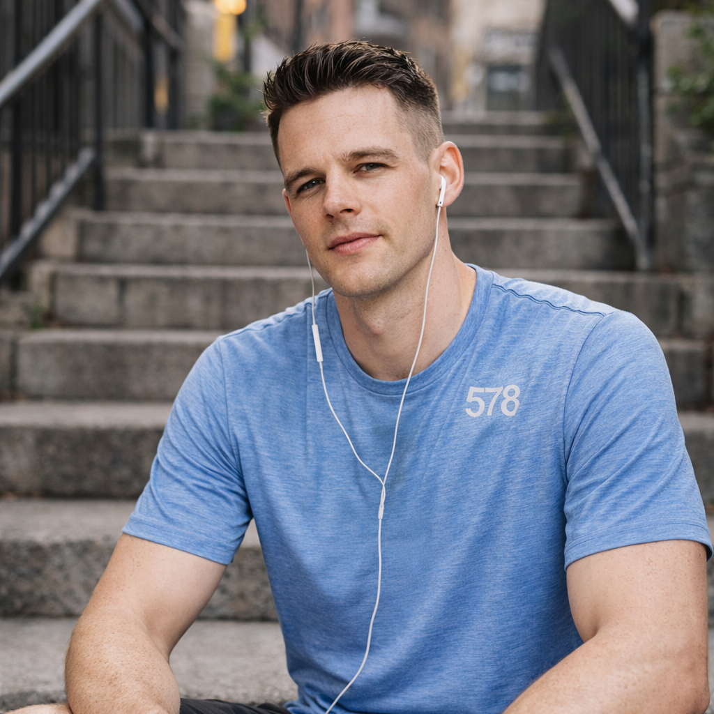 Model wearing Sports Top in blue seated outdoors by Sauce & Brown