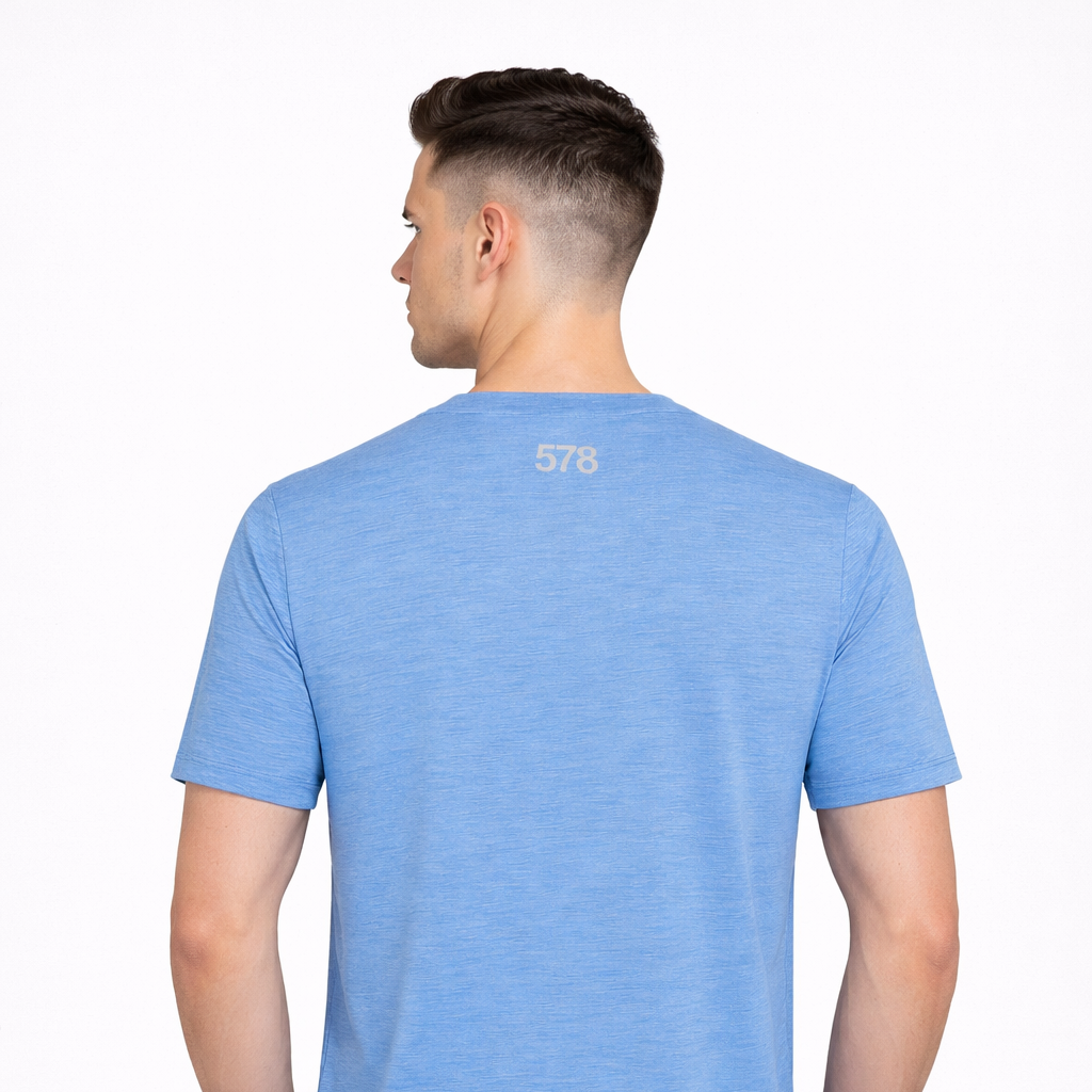 Rear view of Sports Top in blue worn by model by Sauce & Brown